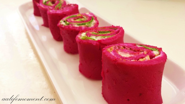 Beetroot Omelette rolls  filled with walnut, fresh spinach and soft cheese